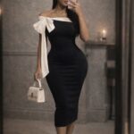 Ivory bow muse dress