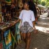 Casual white top and patterned shorts