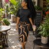 Plain black top with patternized skirt