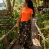 Orange top with flared patternized skirt
