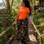 Orange top with flared patternized skirt