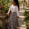 Whit top with flared patternized skirt